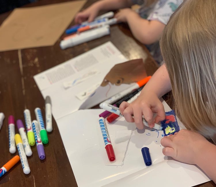 Ada and Zoey using the fabric markers.