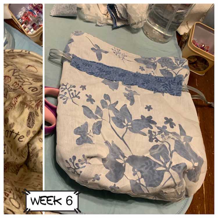 Small vertical image showing a cross-section of inside of the bag. To the right is the outside of the bag laying on the ironing mat. You can see the flannel fabric through the clear 'windows' in the outer flowered fabric. 