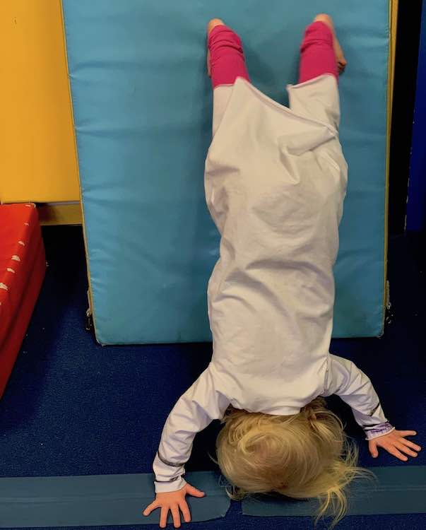 Zoey walked herself up into a leaning handstand while wearing the costume.
