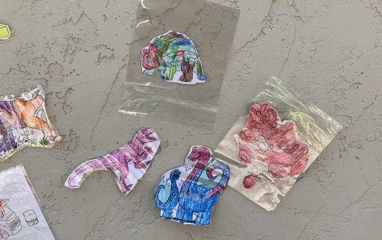 Wall showing laminated color pages used as targets for the water guns.