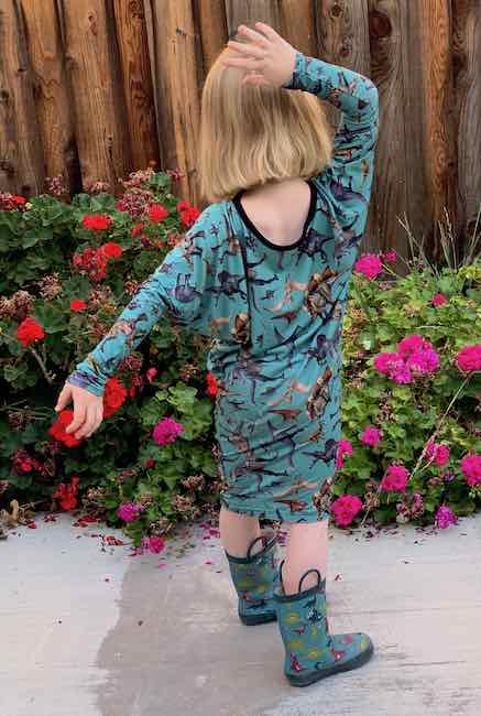Posing while wearing the dress with matching dinosaur rubber boots.