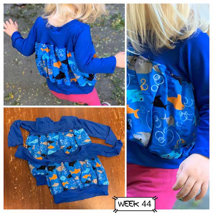 The tulip top was made with blue knit fabric for the sleeves, top, and bottom band. I used shark from for the bubble in the center. The top left photo shows the back of the top, the right photo shows a closeup of the front, and the bottom left photo shows a flat lay of both tops. 