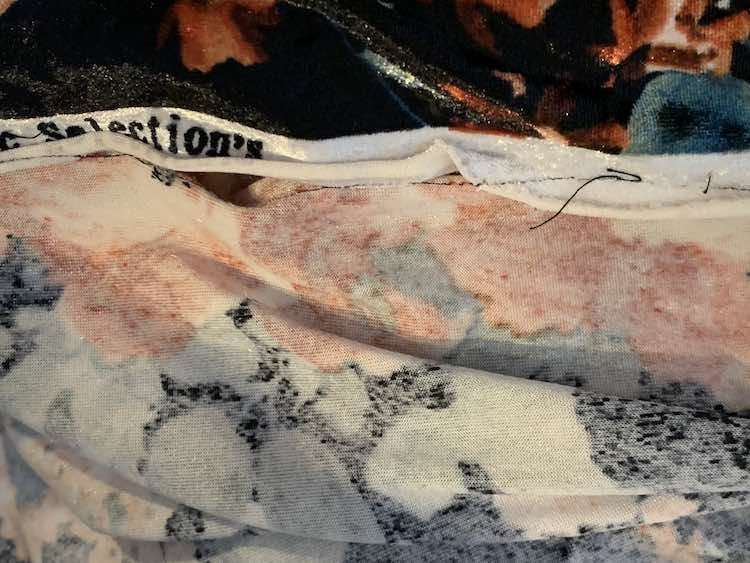 Underside of the channel shows it's not fully enclosed. The center section in this closeup shows a hole with the stitching underneath of the flipped over fabric. 