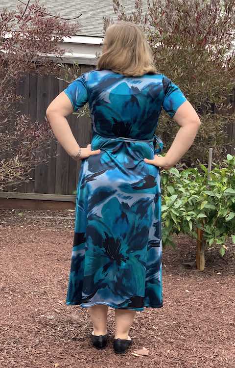 Full view of the back of the dress with my hands on my hips.
