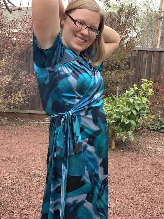 Side view of the dress with my arms up showing the gathered bodice, side seam, and ties. The hem if below the bottom of the photo.
