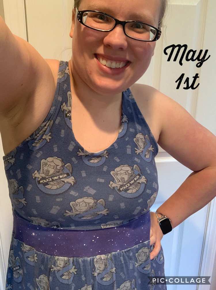 Image showing me wearing a blue dress with crossed out angel statues with TARDISes in the background. I'm smiling as I take a selfie. Beside my head there's font saying "May 1st".