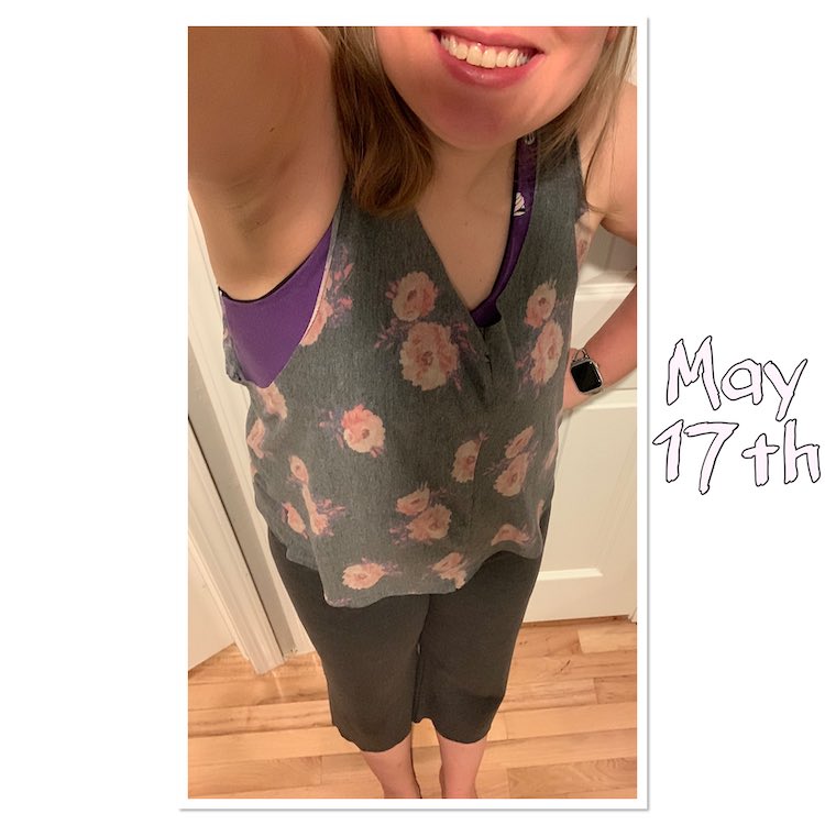 Selfie view of my go to workout gear. I'm wearing grey knee-length knit pants and a drapey grey top with pink flowers on it. The top has unfinished edges along the bottom, neck, and arms and drapes down showing off a bit of my purple brazi workout bra. To the right there's light pink letters saying May 17th.