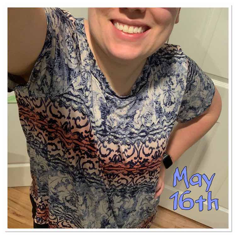 Selfie of a boxy tshirt with slinky fabric so it drapes. It's made with the same horizontally patterned blue, pink, and white fabric as the shirt two days back.