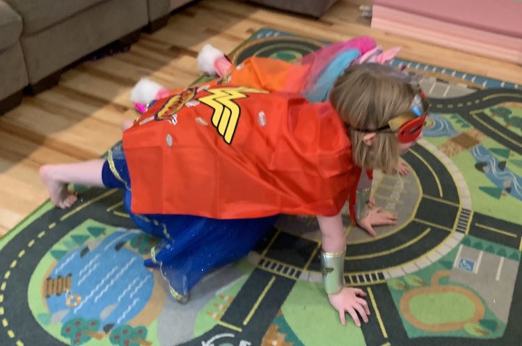 Wonder Woman Ada and Unicorn Superhero Zoey attempting the two pushups.
