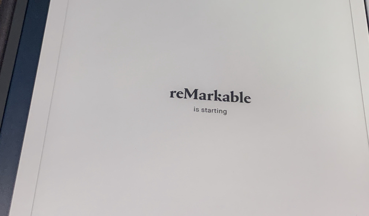 Image shows a white screened reMarkable with the screen reading "reMarkable is starting".