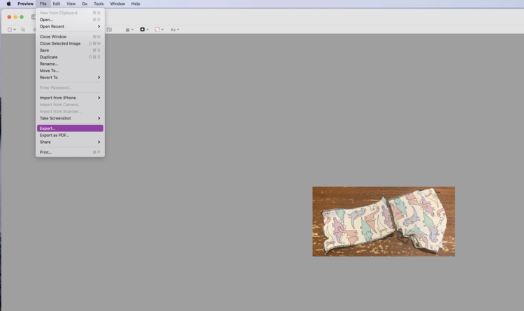 Image shows a very small shirt image surrounded by grey. The top File menu is open and the chose Export... is highlighted in purple.