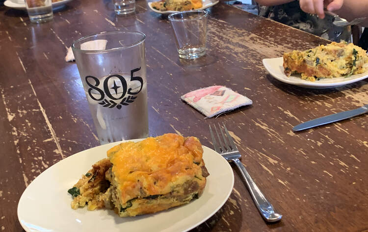 Image shows four saucers filled with the egg dish sitting on the table about to be devoured. 