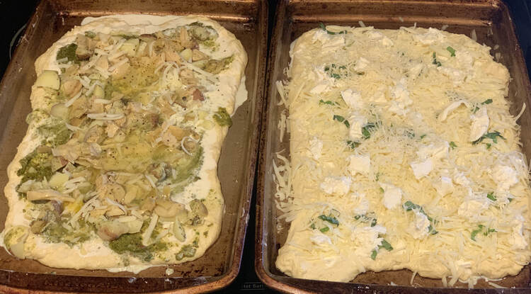 Image shows two different cookie sheets side by side with two different sets of toppings on it. Cold and waiting for the oven. 