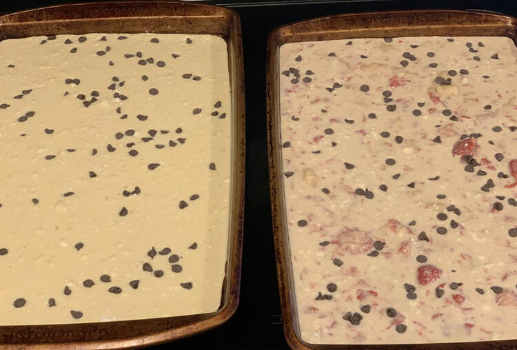 Image on the left is plain unbaked pancake batter with chocolate chips on top. To the right there's also chocolate chips but the batter is tinted pink with lumps of pink strawberries inside. 