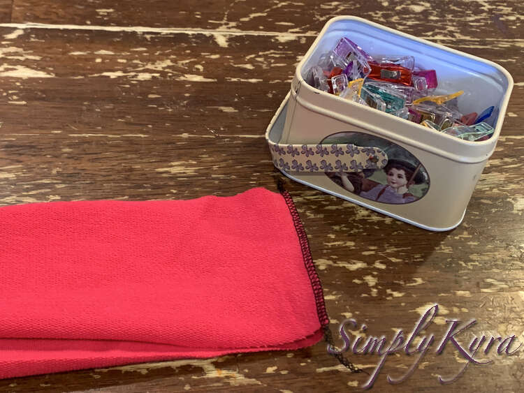 Image shows the two stacked strips with a black serger seam connecting them at one of the short ends.