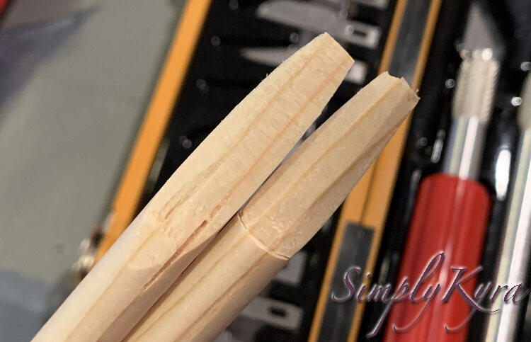 Image shows the two pieces of dowel with the angled and smoothed tips. 