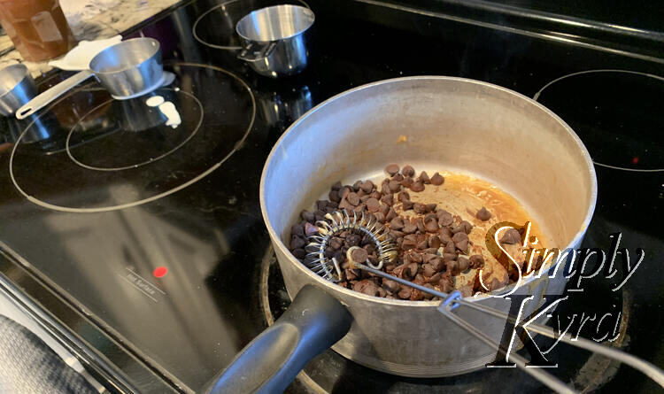 Image shows a pot with the odd bit of hardened caramel showing at the bottom and a pile of chocolate chips.