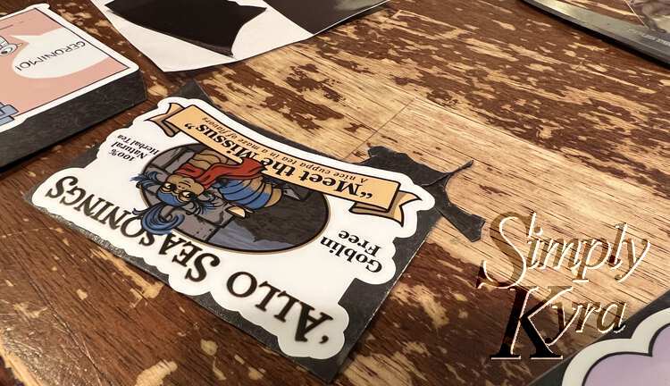 Image shows a closeup of the Labyrinth-inspired sticker with two other pieces of magnet attached to the lower left side of the sticker. It's turned around so in the photo it looks like the upper right side. 