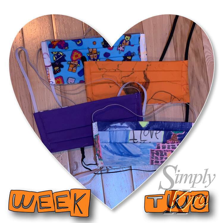 Image shows a heart shaped photo on a white background with the words "week two" along the bottom in orange. The image shows four horizontally pleated face masks. 