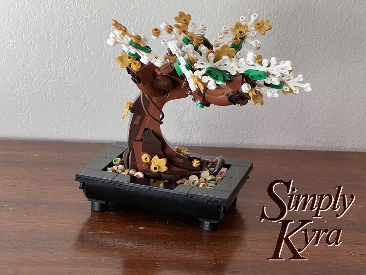 Image is taken from the side with the black base on the wooden surface and no brown base between them.