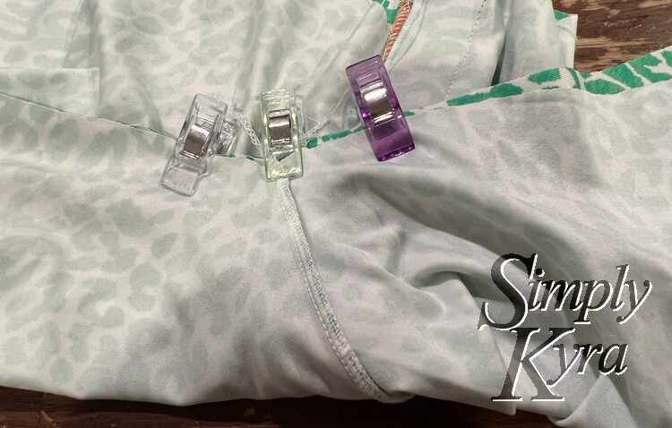 Image shows a closeup of the armpit section with three clips holding it in place so it stays lined up and secure.