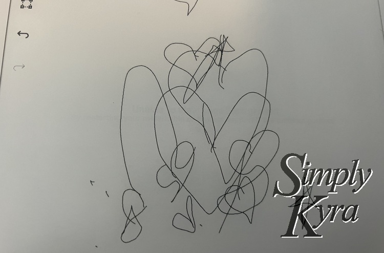 The reMarkable now shows many doodles including the heart in the previous image. There's no message and the background is blank. 