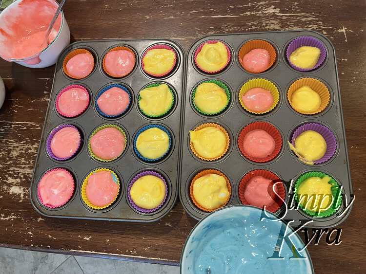 Image shows a closer look at the cupcakes from before. Now the left eight are red and then the center eight are yellow. The two rows on left are only half filled and consist of four reds and four yellows.