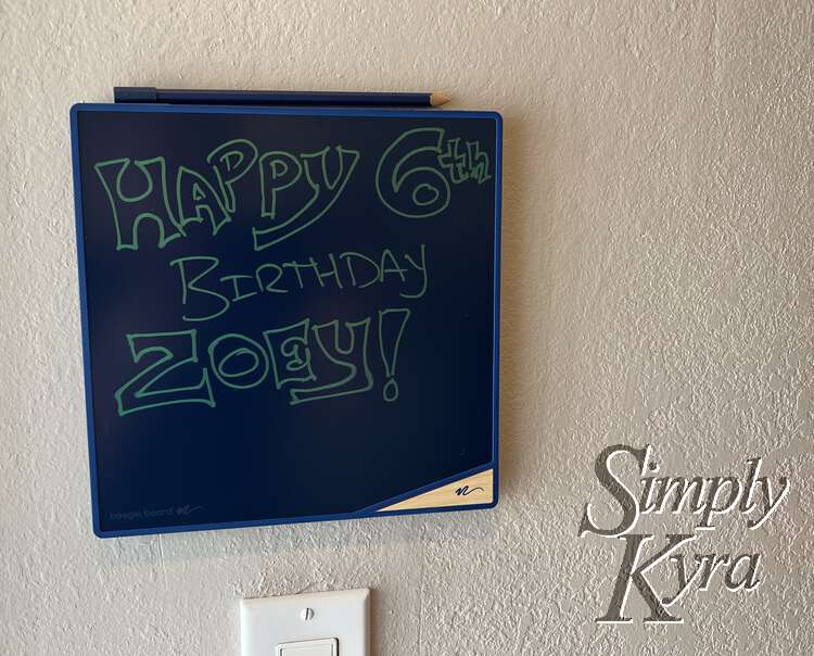 Image shows a black board saying "Happy 6th Birthday Zoey!"