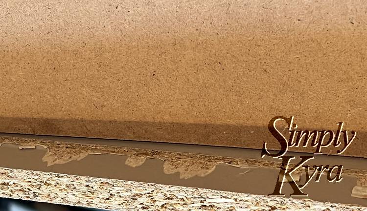 Same view of the drawer as the previous one but now the bottom was pushed down (hands out of sight) so you can see the inside of the drawer including where the groove that the base was supposed to be in.