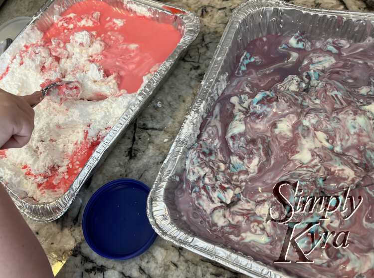 Image shows the pink casserole partially mixed in while the marbled purple, blue, and white dish on the right shows a more oobleck-like consistency. 