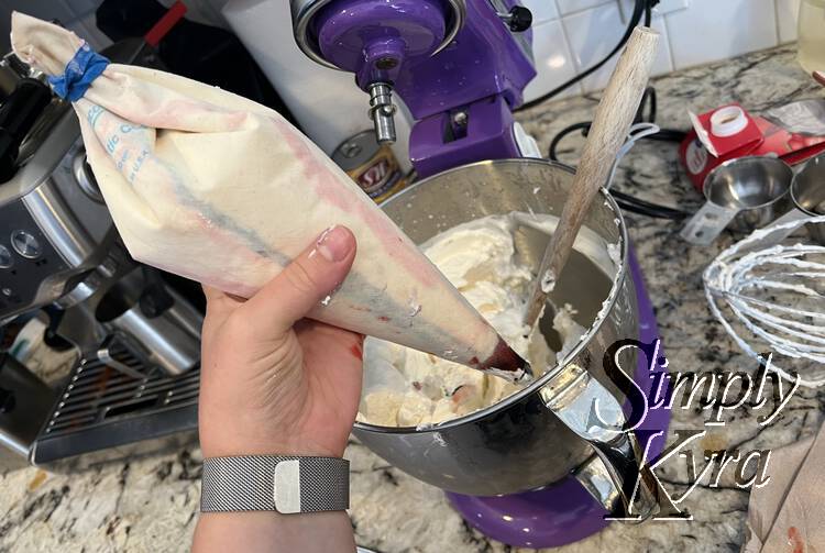 Image shows the outside of the closed piping bag with obvious blue and red streaks showing from the outside.