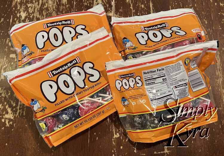 Image shows the four bags of Tootsie Roll pops I bought. The one bag is turned around so you can see the serving size amount under the Nutrition Facts header. 